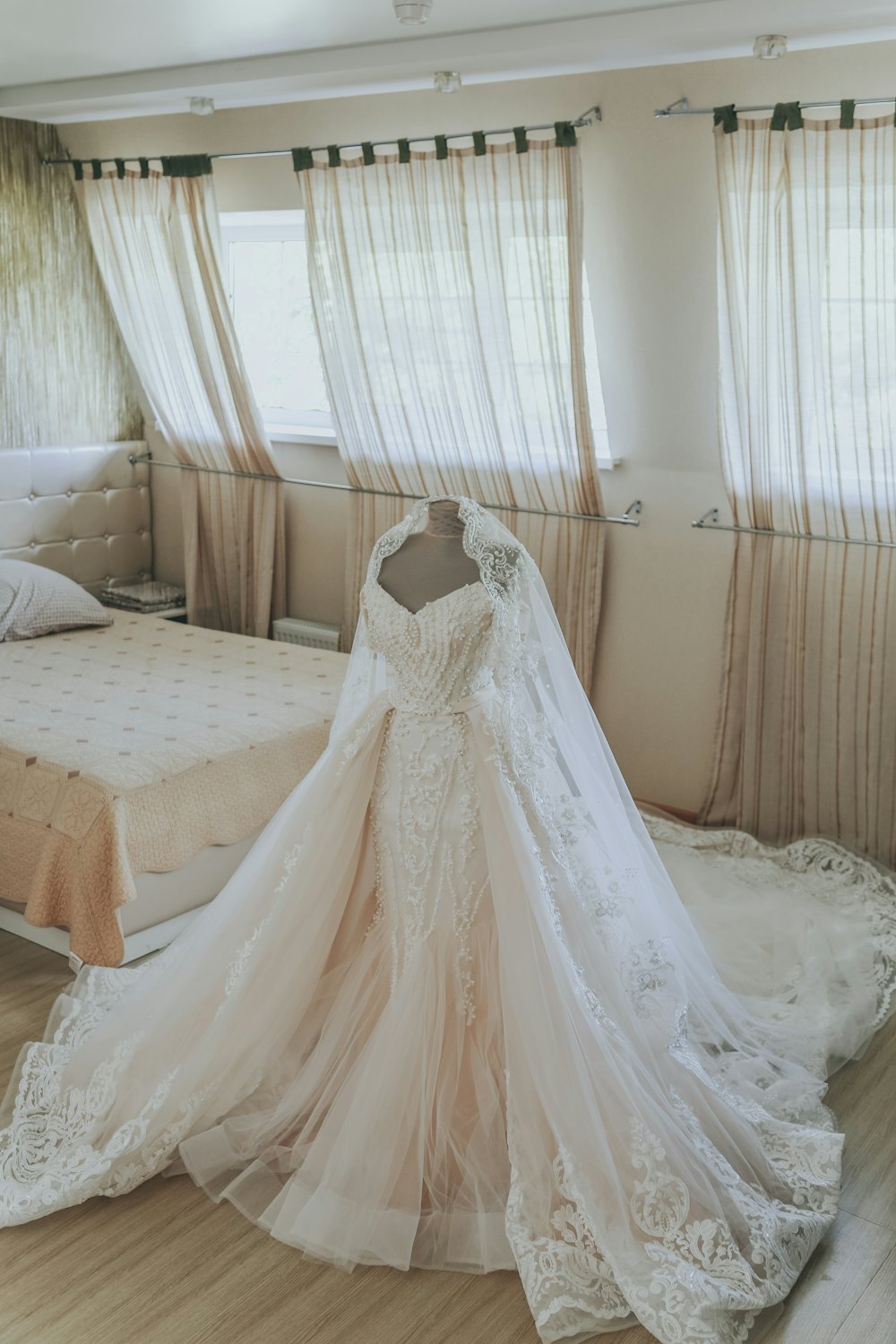Ball gown laid out with a veil