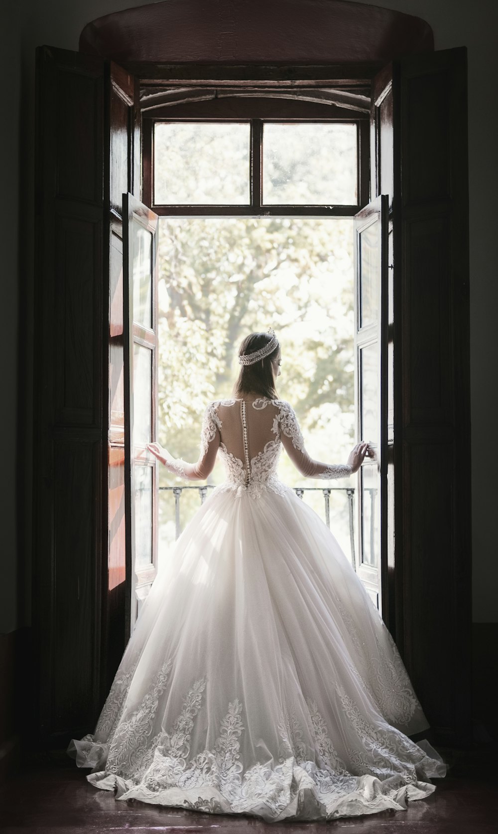 Bride in a ball gown in a doorway