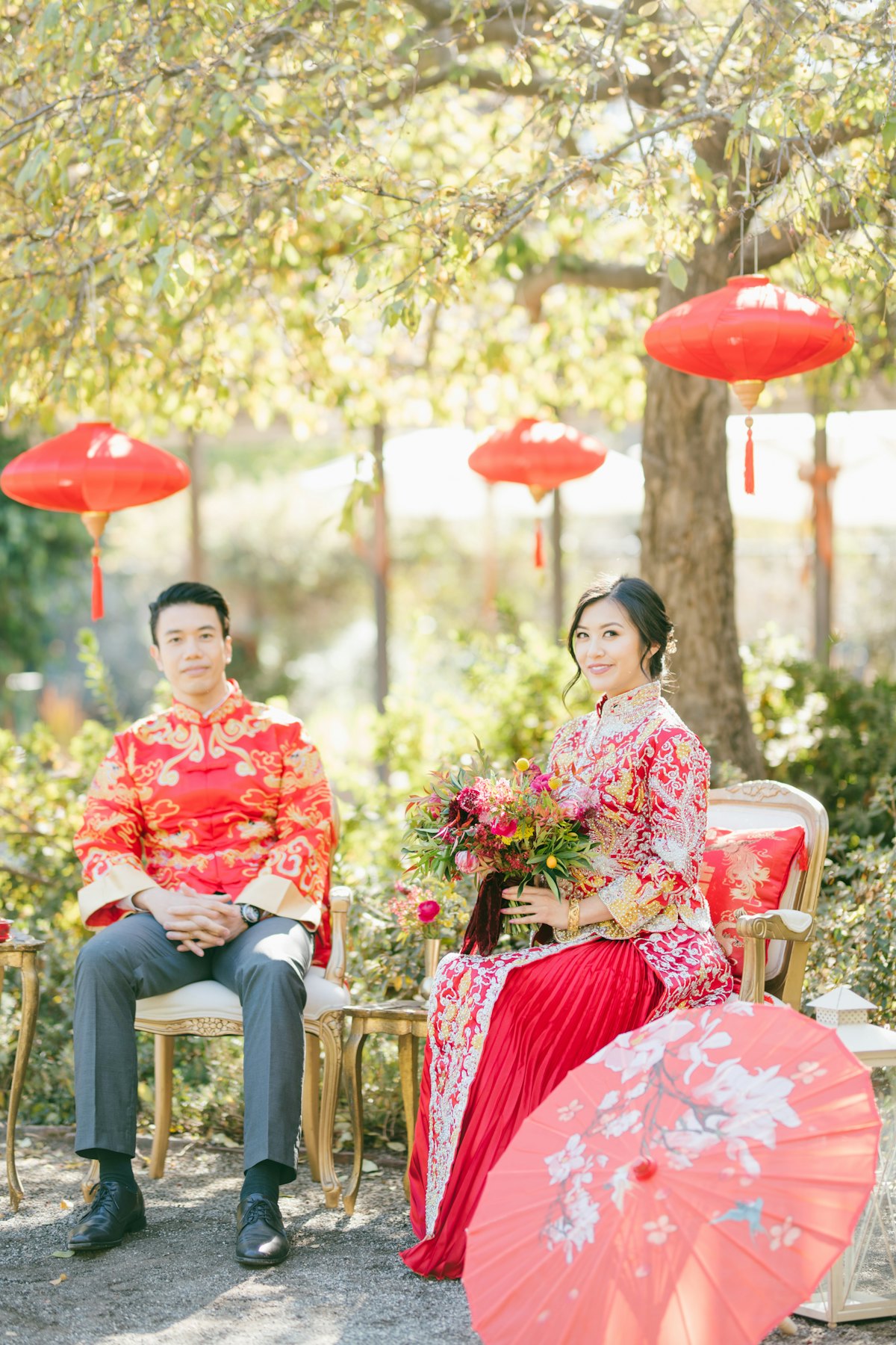 Couple in red Kua under paper lanterns