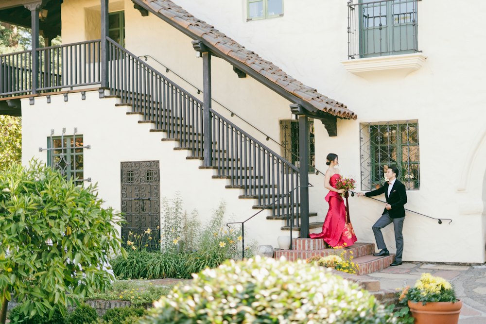 Couple on white stairs outside a heritage building